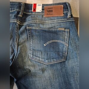 Womans size 28 Gstar 3301 straight medium aged blue denim